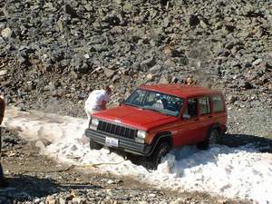 Person stuck in snowbank high in the Rockies
